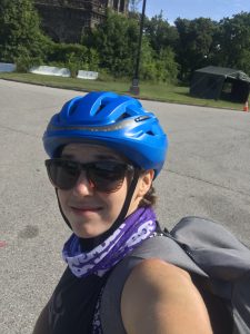 Headshot of library staff on bike with helmet