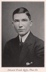 Headshot of a man in a suit and tie.