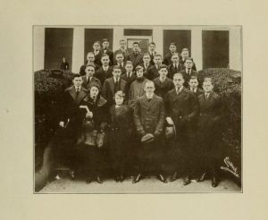 Group photograph of 28 students in front of a building.