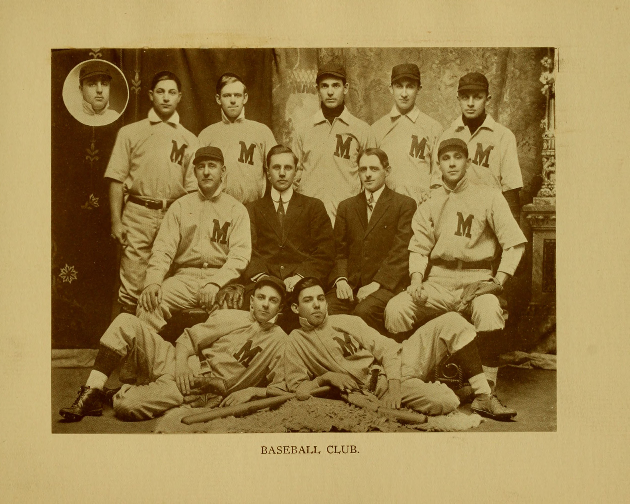 Black and white photograph of a group of men in baseball gear.