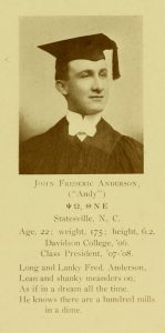 Black and white yearbook photograph of man in cap and tassel.