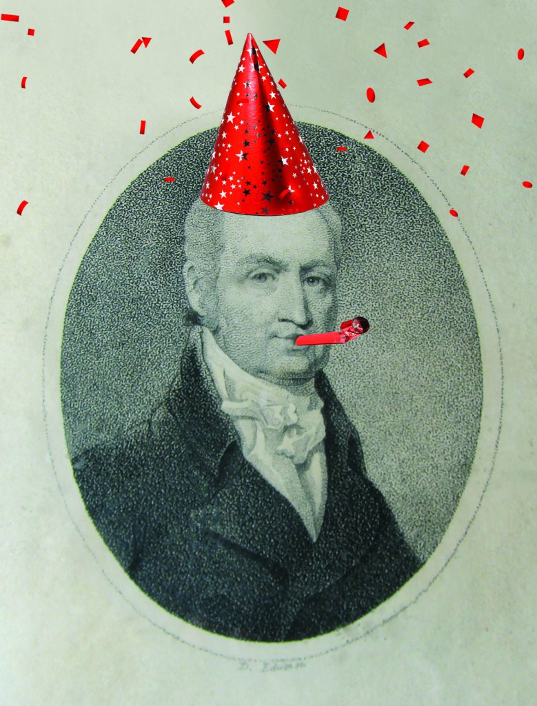 Photograph of Dr. John Crawford, man with a suit and tie, with a silly birthday hat, confetti, and birthday noisemaker photoshopped on the image