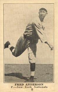 Black and white photograph of a man in baseball uniform throwing a ball.