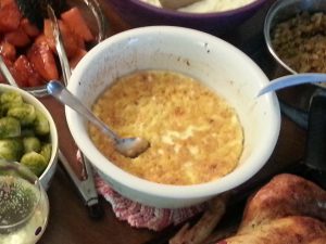 Photograph of a white bowl  with yellow sweet corn dish