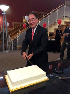 Dr. Perman Cutting the Cake